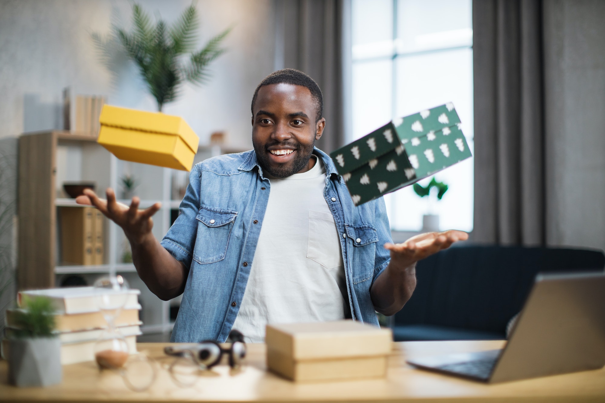 african-influencer-taking-fun-while-unpacking-gift-boxes.jpg